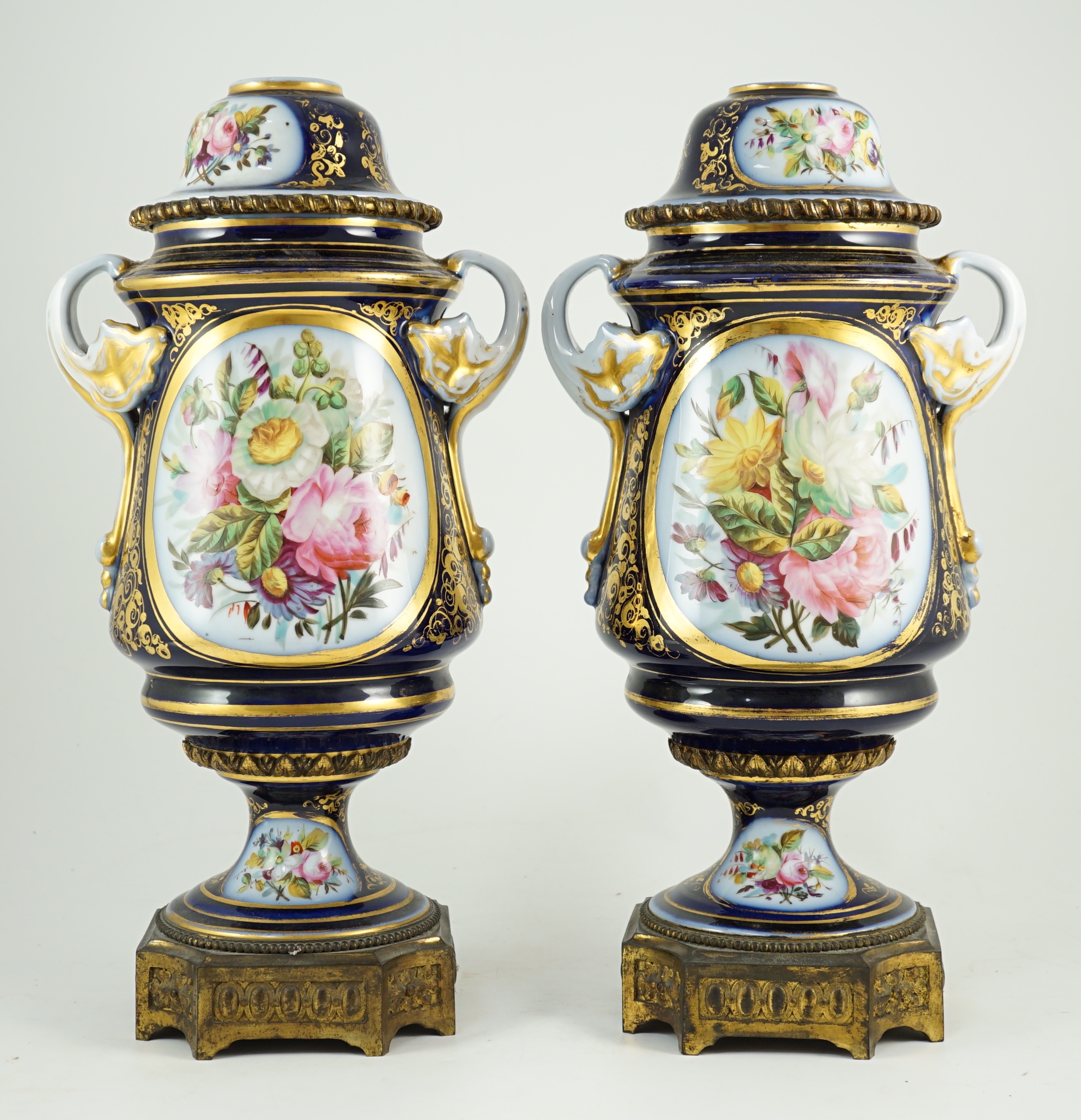 A pair of Sevres style Paris porcelain and ormolu mounted oil lamps, late 19th century, 43 cm high